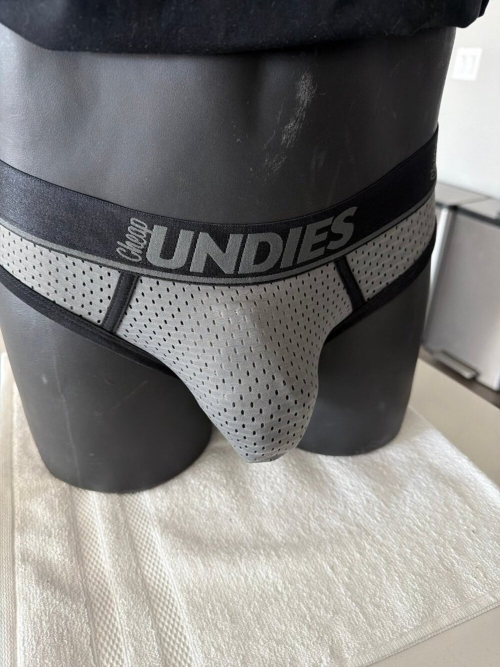 Grey mesh jock brief with a wide logo waistband